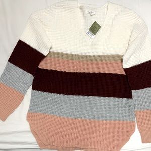 A white and pink sweater. Size 14.